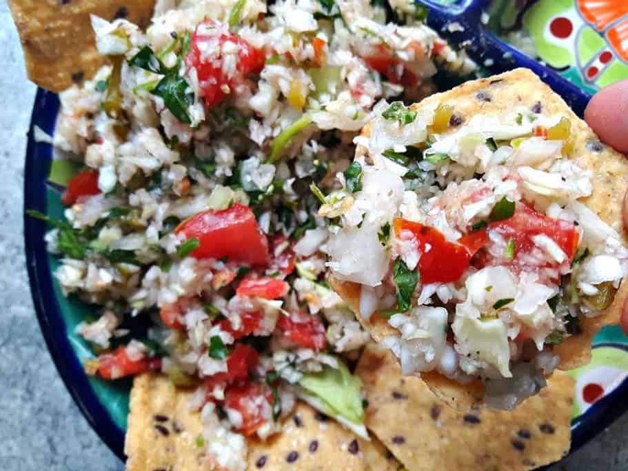 Cabbage Pico De Gallo (Salsa Fresca) on a tortilla chip