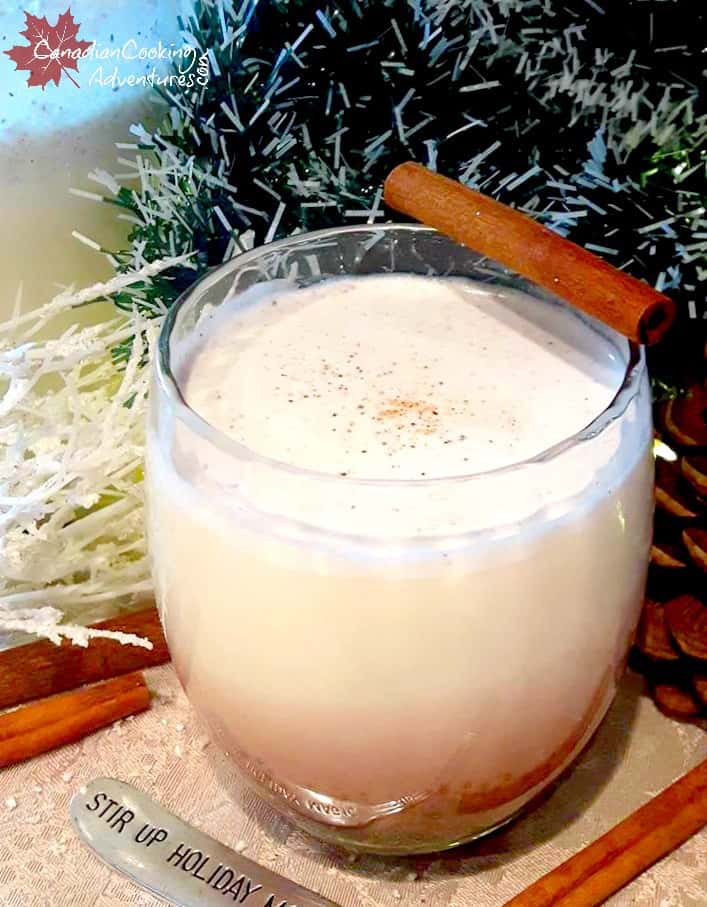 Classic Eggnog with cinnamon stick and grated nutmeg