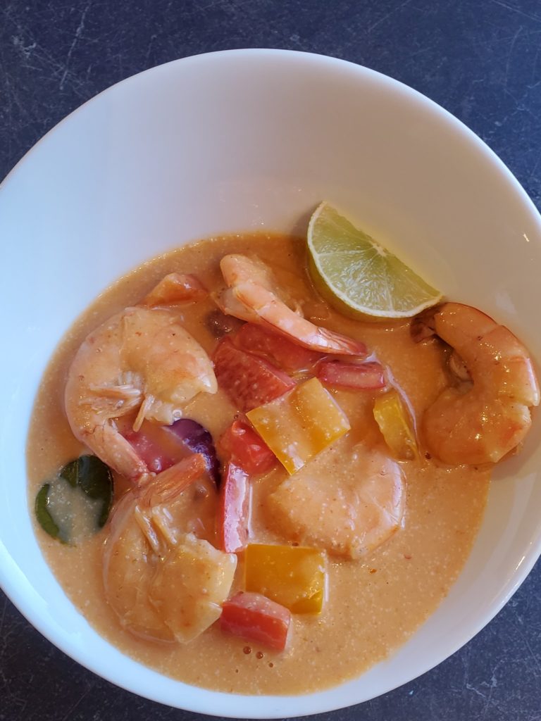 Thai Red Curry Shrimp Recipe in a white bowl with a lime