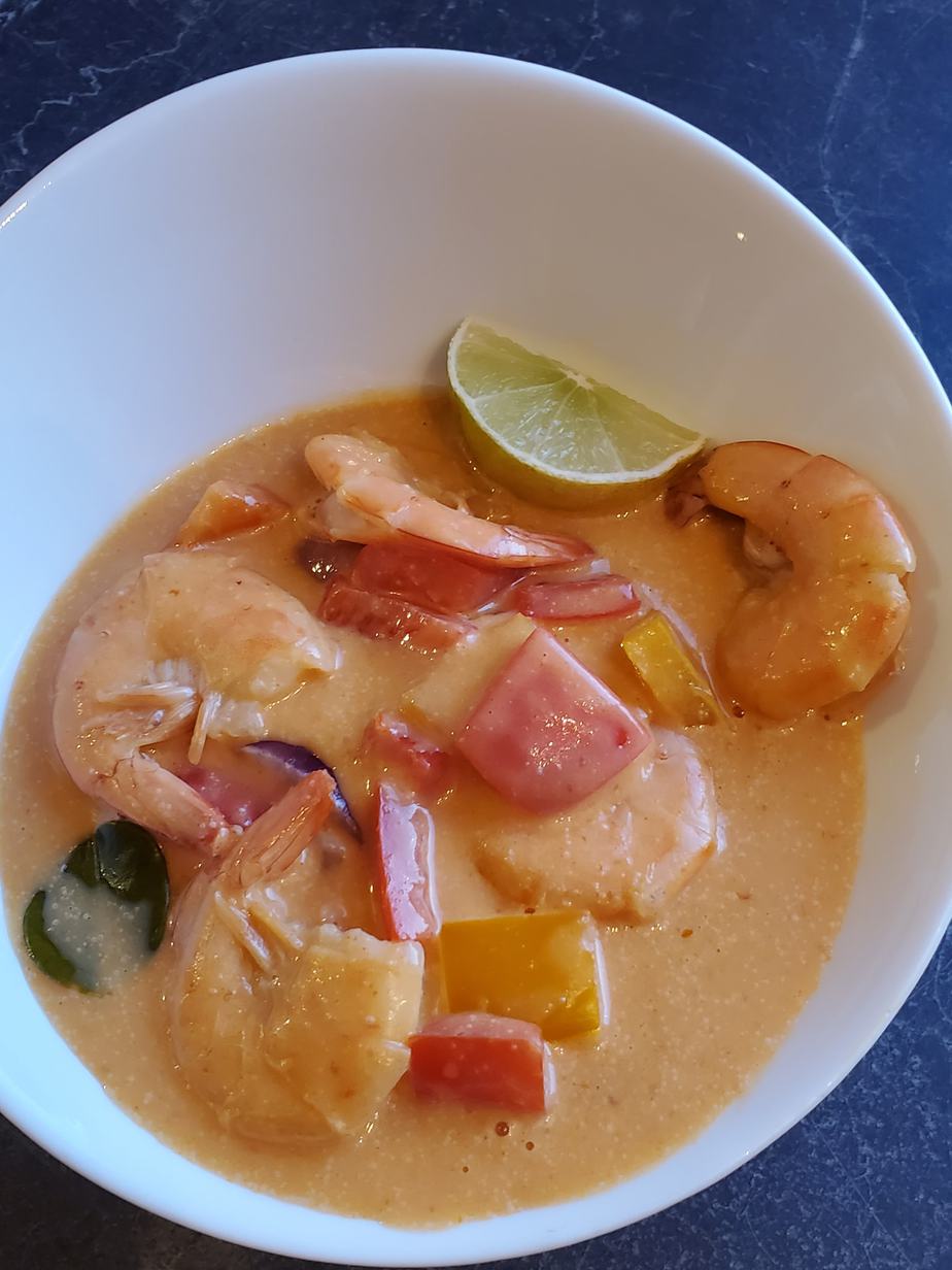 Thai Red Curry Shrimp Recipe in a white bowl with a lime