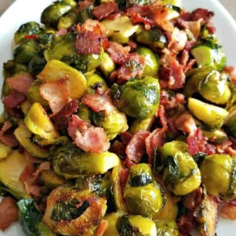 bacon brussel sprouts served on a white plate
