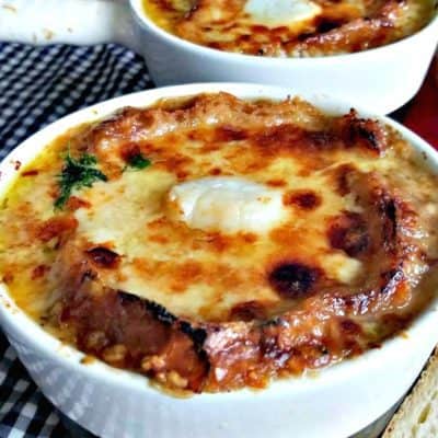 French Onion Soup with Broiled Scallops in two bowls