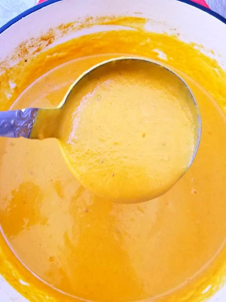Thai Carrot Soup scooped with a ladle